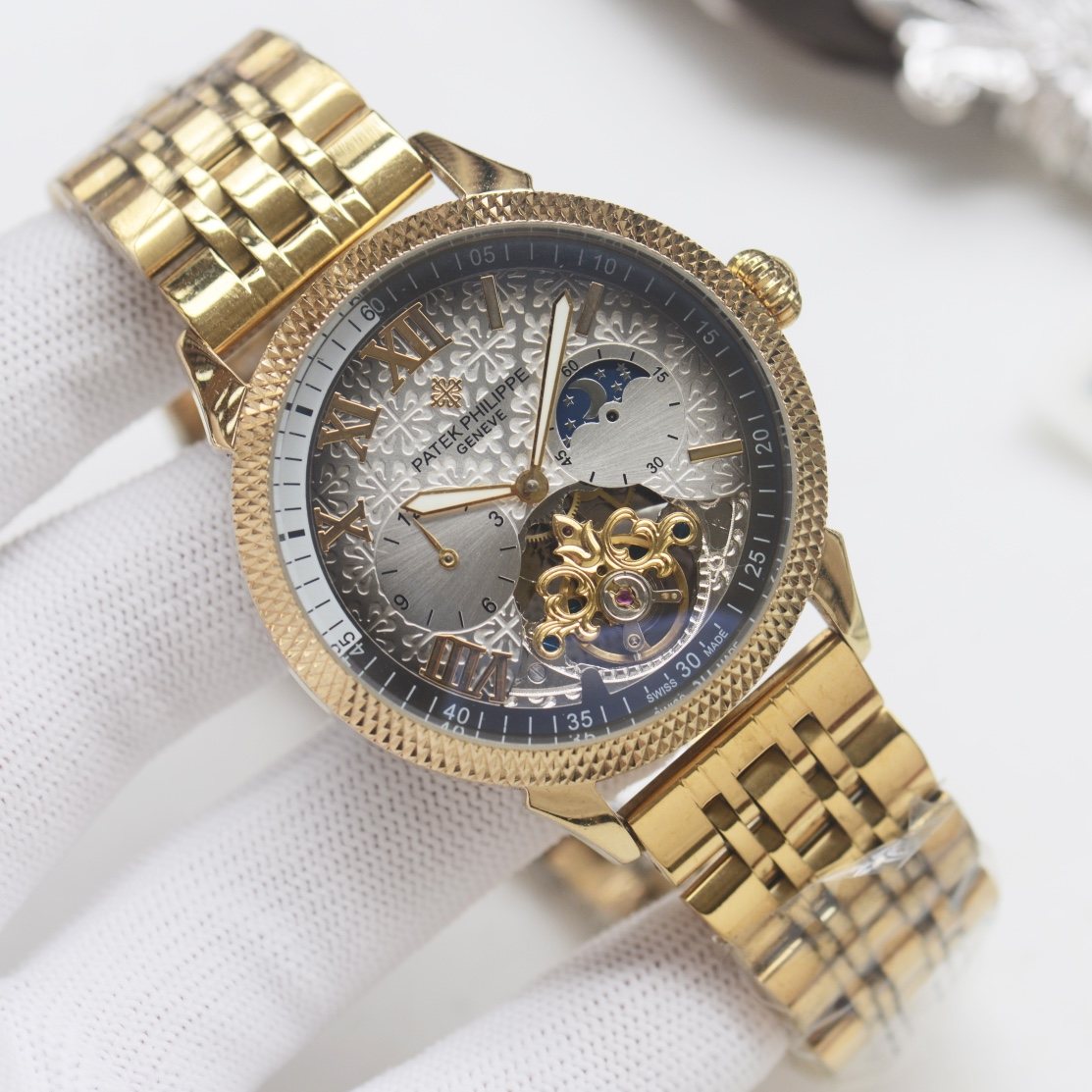 Patek Philippe Gold Silver Dial Bracelet Watch — hero