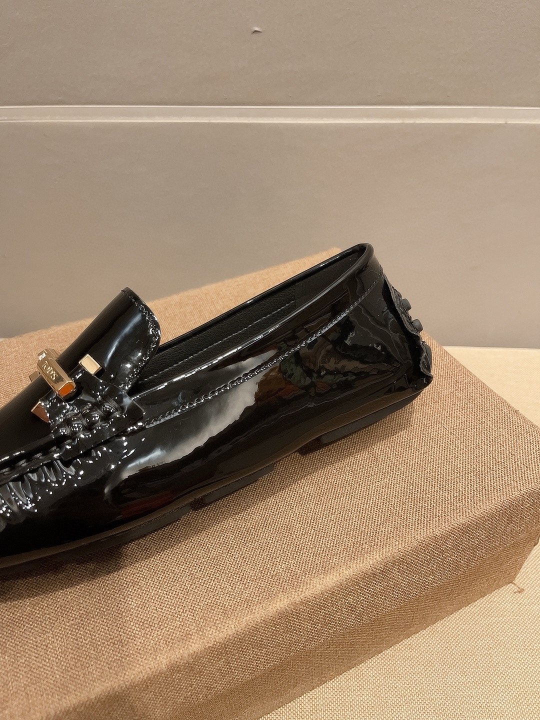 Tod's Glossy Metal Bar Loafers — detail