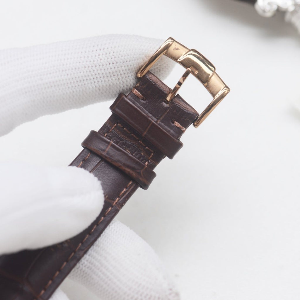Patek Philippe Rose Gold White Strap Watch — detail