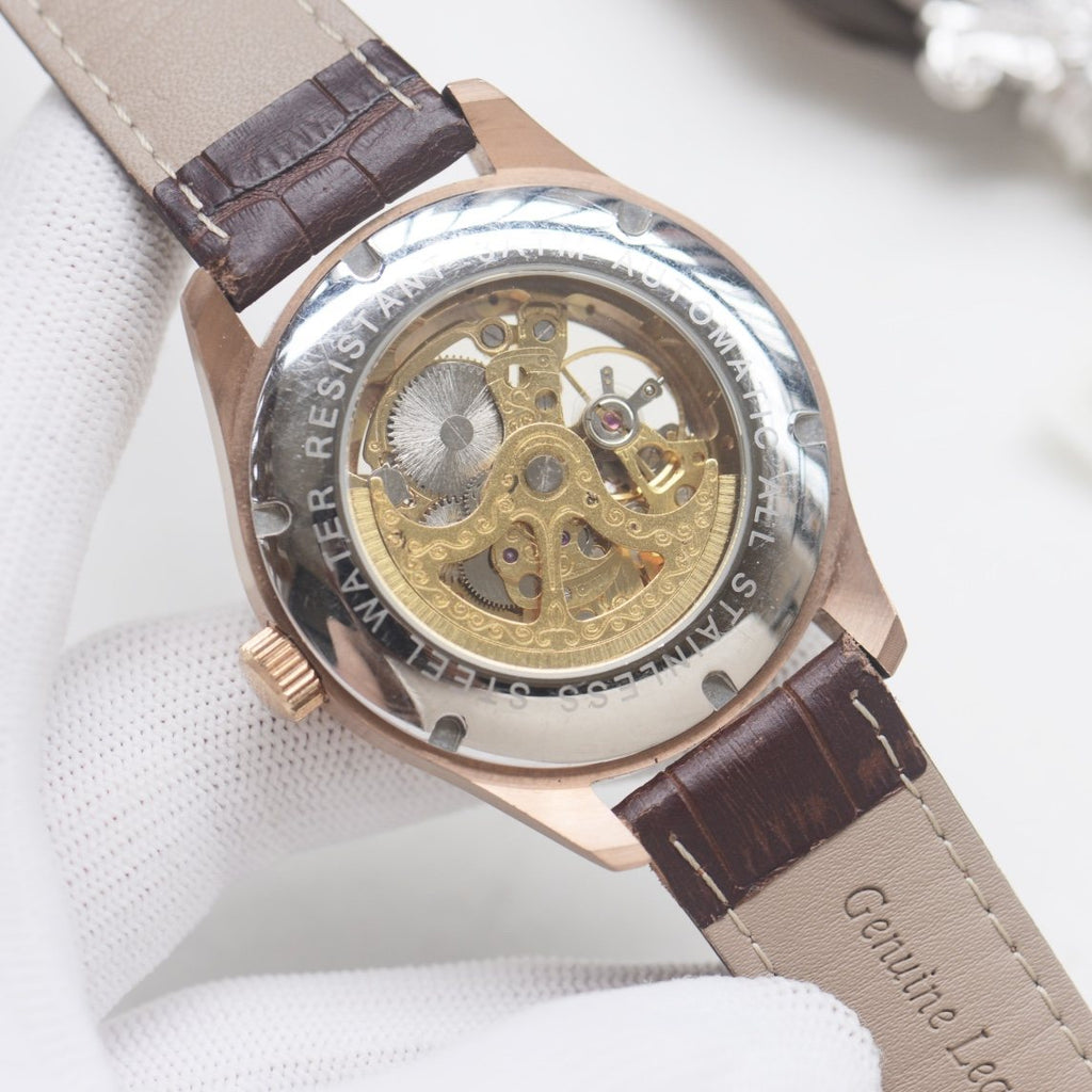 Patek Philippe Rose Gold White Strap Watch — back