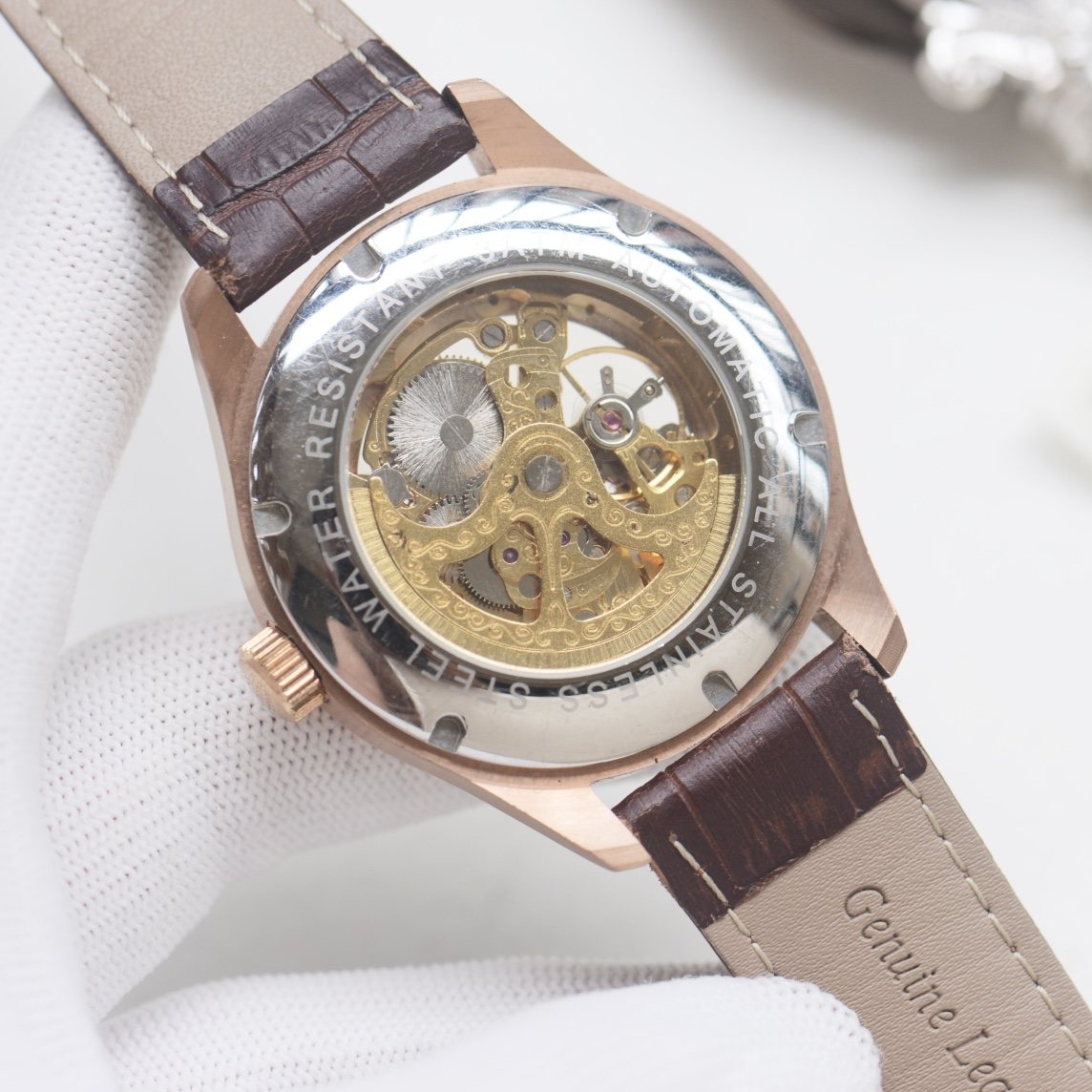 Patek Philippe Rose Gold White Strap Watch — back