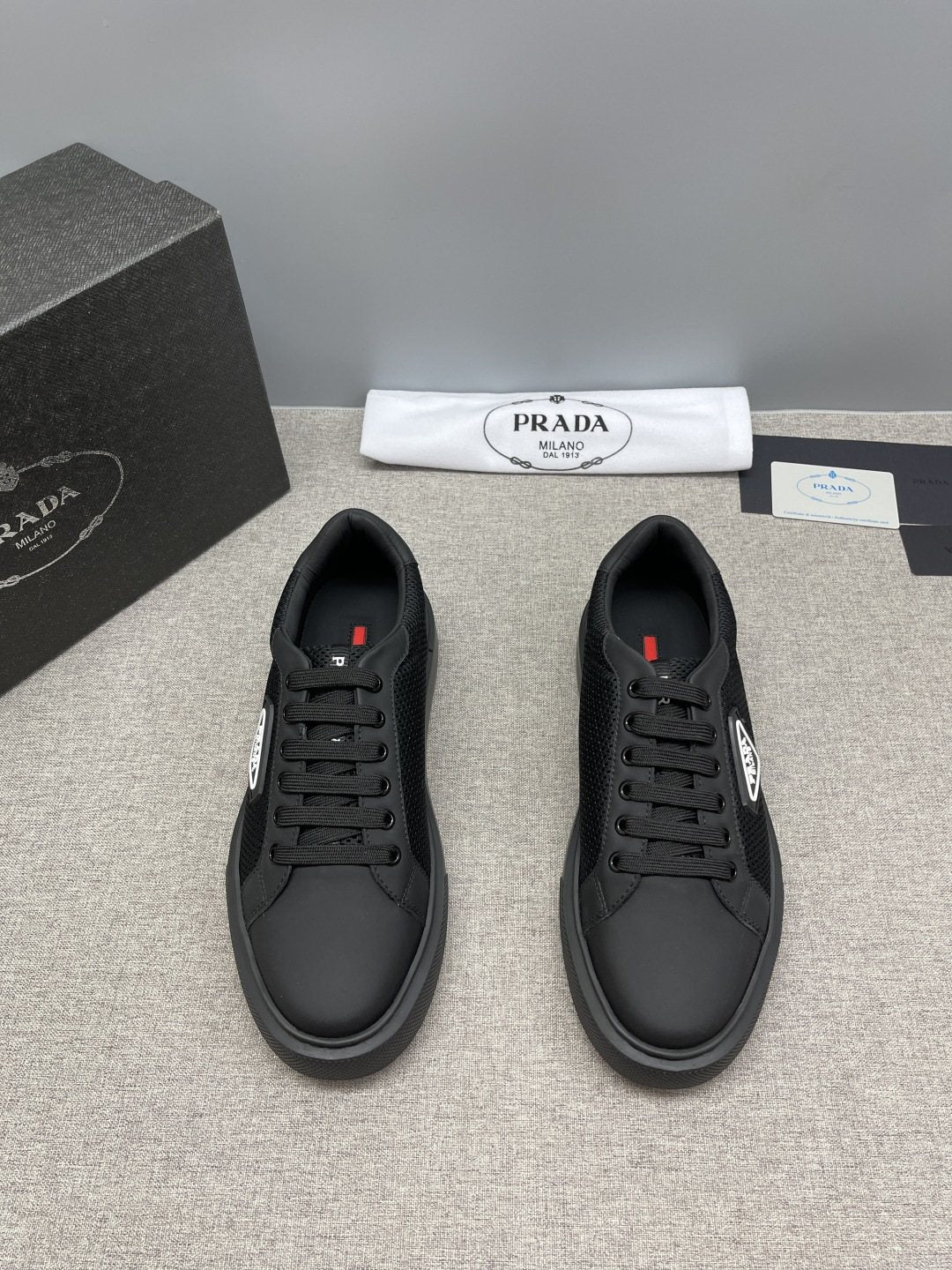 Prada Triangle Patch Low-Top Sneakers — front