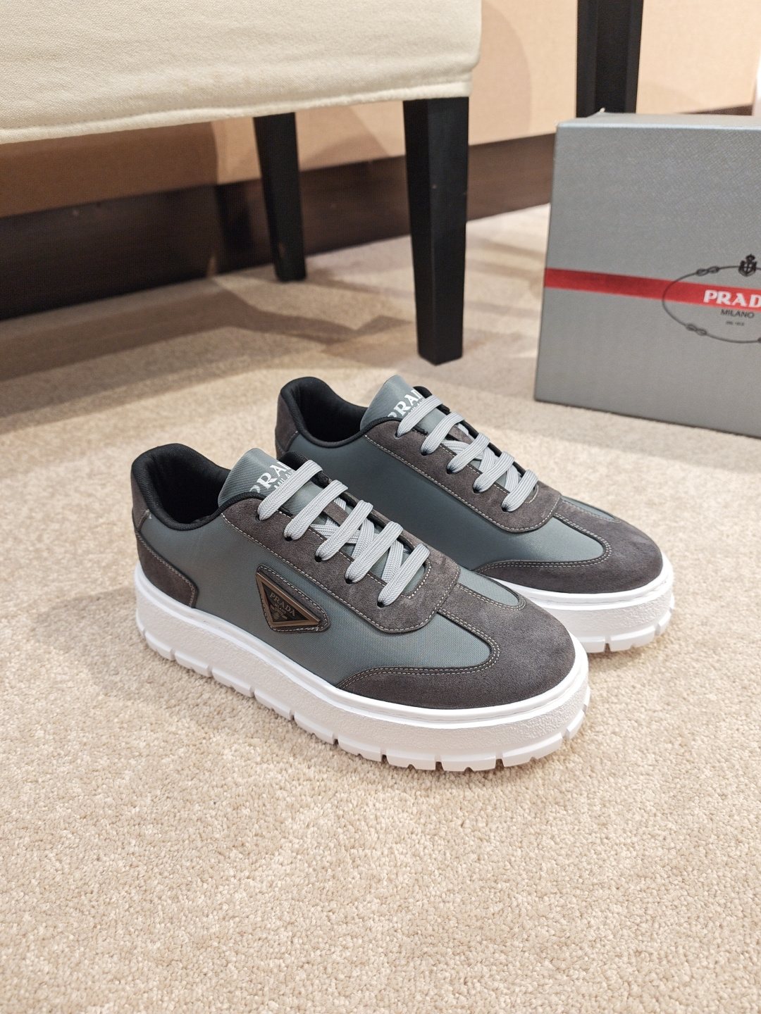 Prada Triangle Plaque Low-Top Sneakers — front