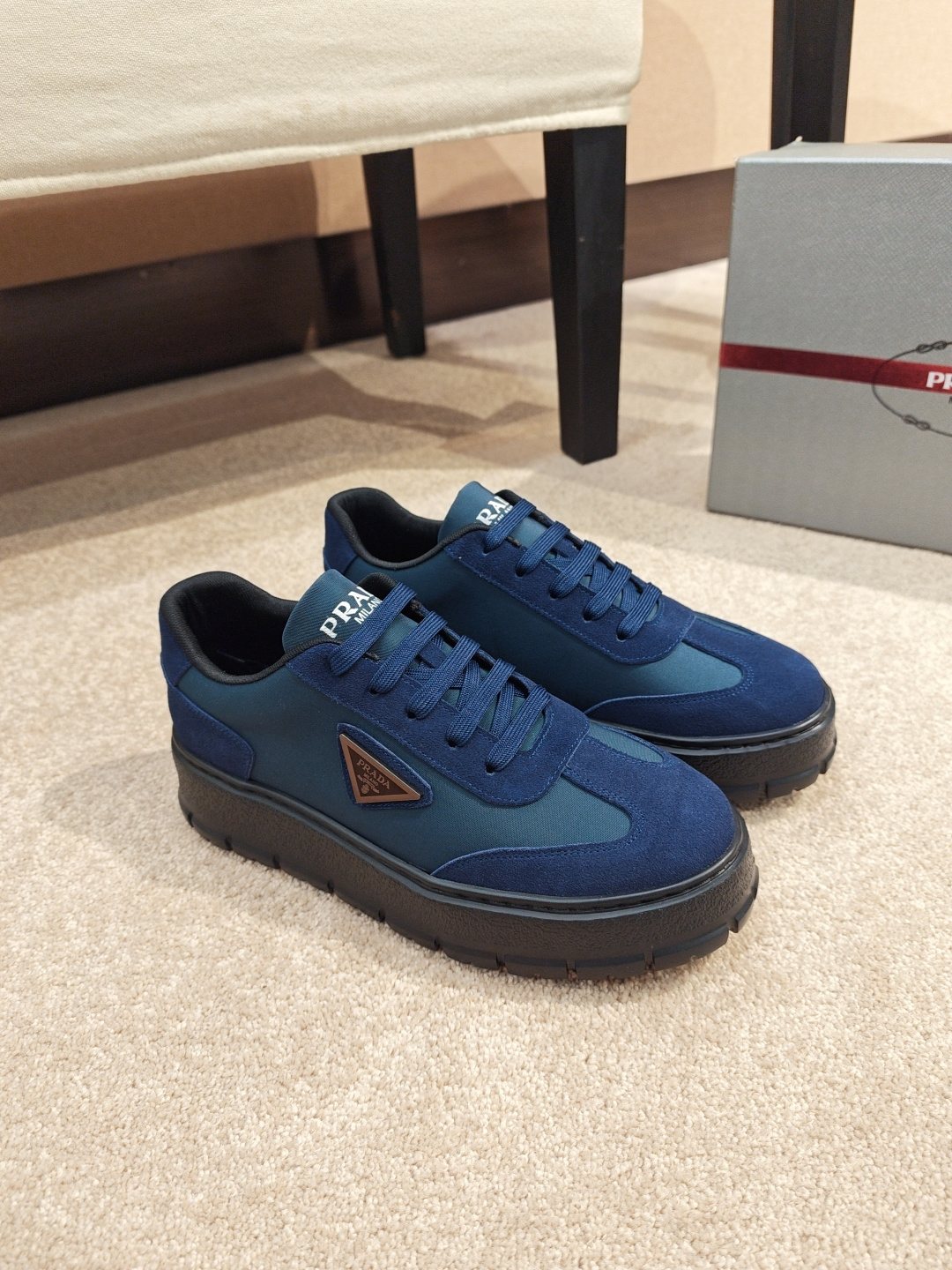 Prada Triangle Plaque Low-Top Sneakers — front