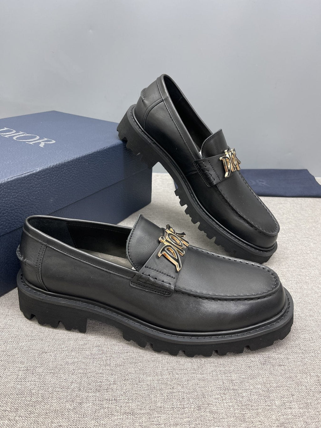 Dior Black Gold-Plaque Slip-On Shoes — side